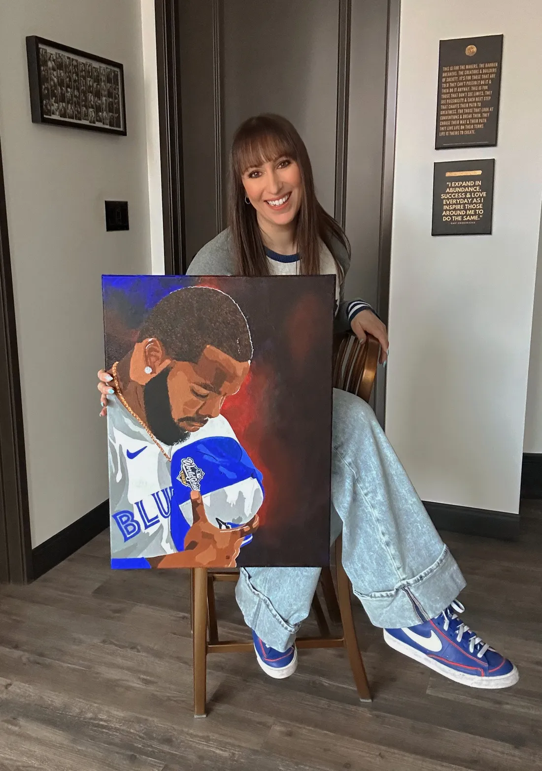 Georgia Sapounas with one of her original portrait paintings